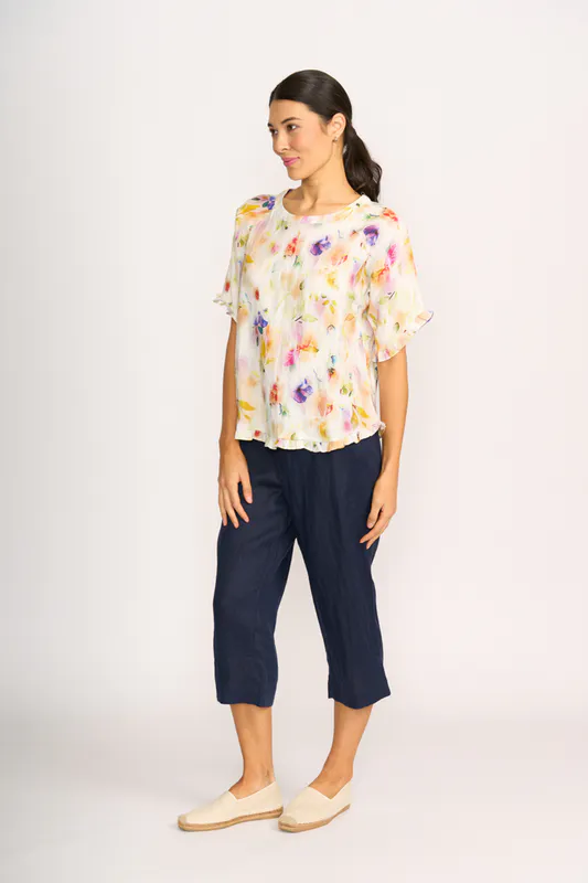 Model wearing Mist Floral Top - Ruffles & Scoop Hem By Preen Available at Beetees Nelson