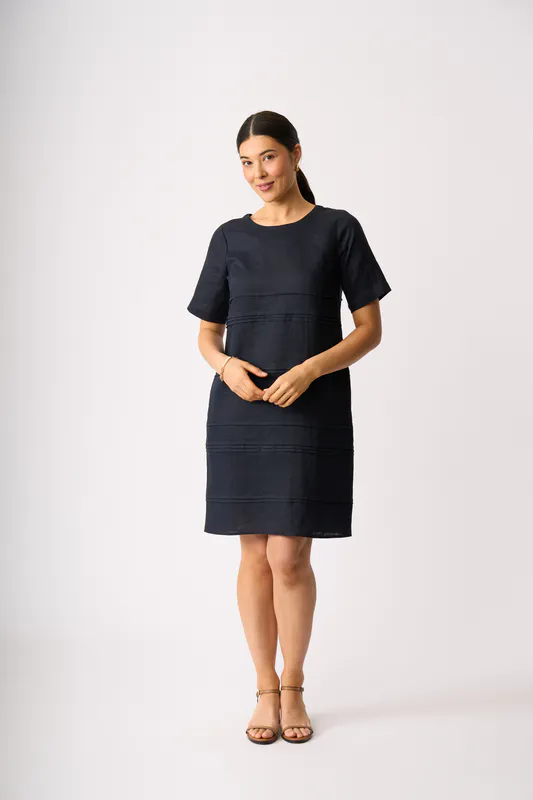 Model wearing True Navy Crowd Favourite Dress By Foil Available at Beetees Nelson