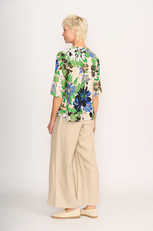 Model wearing Floral Delight Pintuck Scoop Hem Top By Foil Available at Beetees Nelson