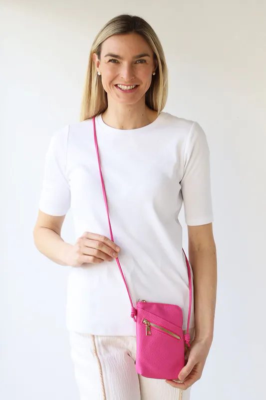 Model wearing Hot Pink Long Cross Body Shoulder Strap Bag By Archer House Available at Beetees Nelson