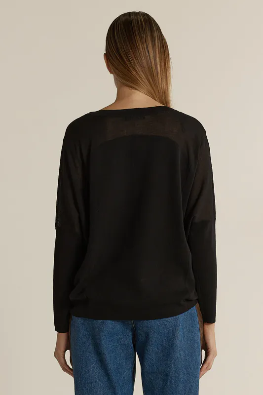 Model wearing Black Charlie Knit By Fate & Becker Available at Beetees Nelson