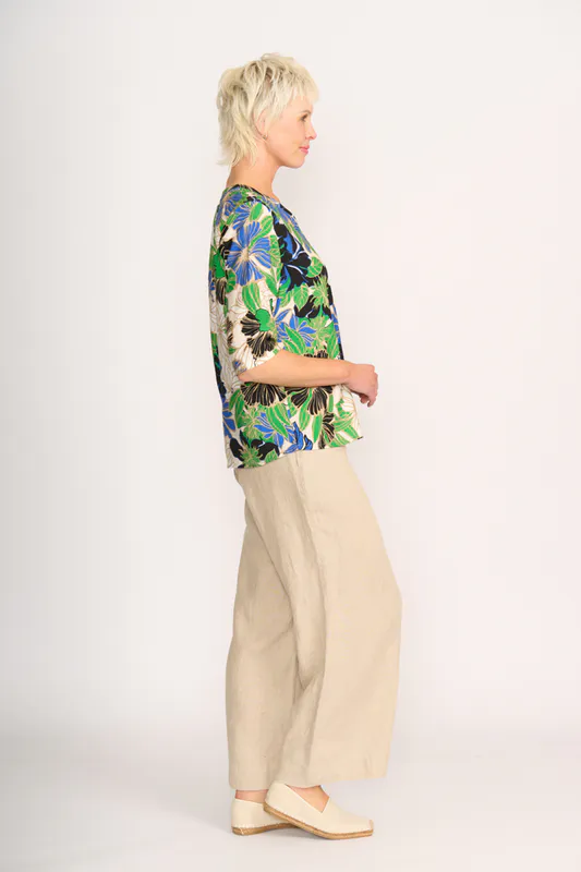 Model wearing Floral Delight Pintuck Scoop Hem Top By Foil Available at Beetees Nelson