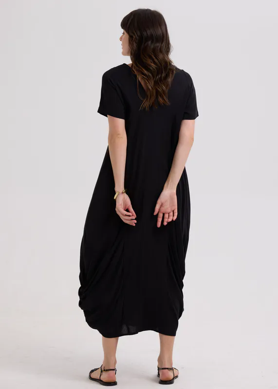 Model wearing Black Drape Bottom Dress By LD + CO Available at Beetees Nelson