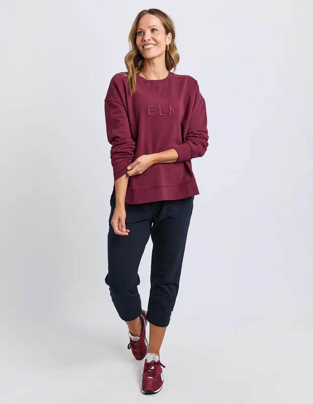 Model wearing Plum Established Crew By Elm Available at Beetees Nelson
