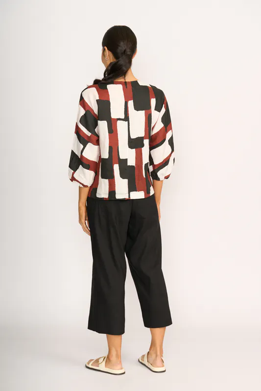 Model wearing Spice Box Plot Twist Top By Foil Available at Beetees Nelson