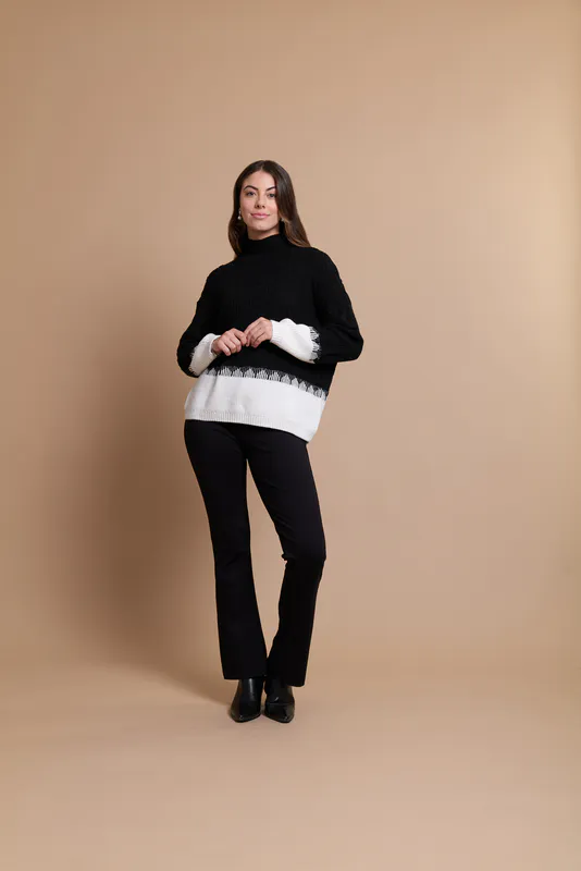 Model wearing Black/White Coloured Jumper - Cable Knit, Contrast Hem By Oh Three Available at Beetees Nelson