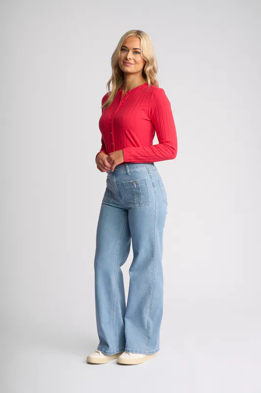 Model wearing Light Wash Denim Lottie Jean By Vassalli Available at Beetees Nelson