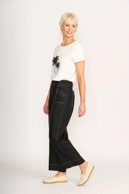 Model wearing Shady Palms Tee - Round Neck By Preen Available at Beetees Nelson