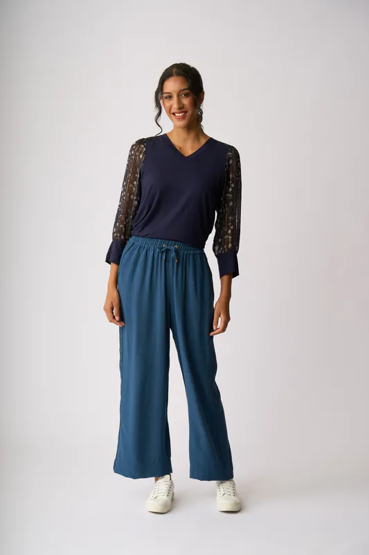 Model wearing Twilight Floral Contrast Woven Shoulder Top By Memo Available at Beetees Nelson