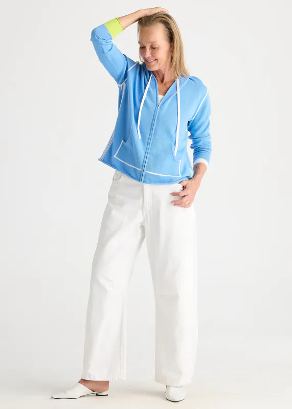 Model wearing Cornflower Sports Hoodie By Zaket & Plover Available at Beetees Nelson