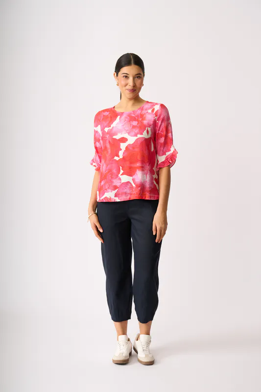 Model wearing Fantasia Ruffle Sleeve Scoop Top By Foil Available at Beetees Nelson