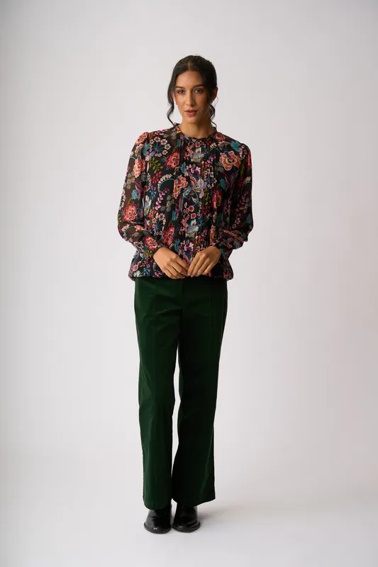 Model wearing Floral Burst Pintuck Front, Shirred Cuff Blouse By Memo Available at Beetees Nelson