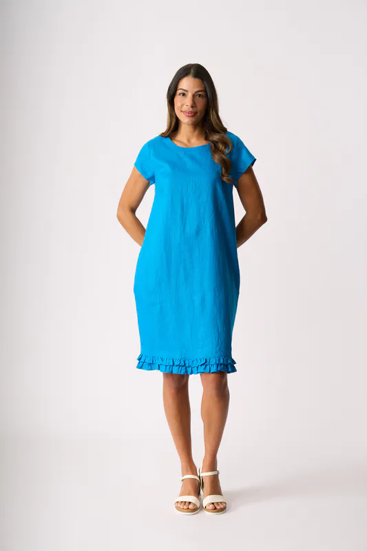 Model wearing Ocean Ruffle Dreams Dress By Foil Available at Beetees Nelson