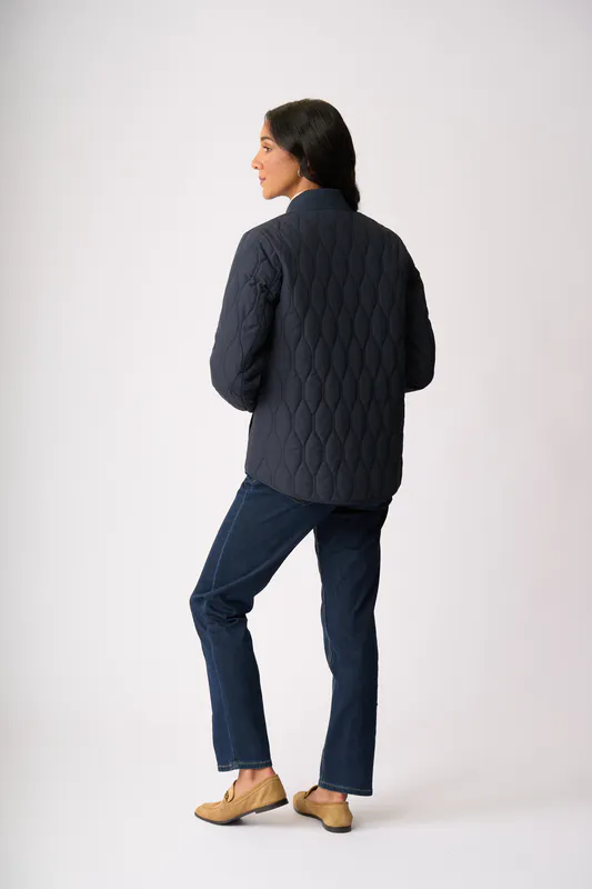 Model wearing Midnight Quilted Snap Jacket By Foil Available at Beetees Nelson