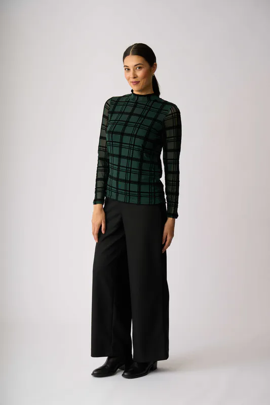 Model wearing Green Check Top - Long Sleeve Polo Neck By Foil Available at Beetees Nelson