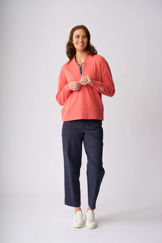 Model wearing Coral Flaxton 1/2 Zip Sweat By Charlie Jane Available at Beetees Nelson