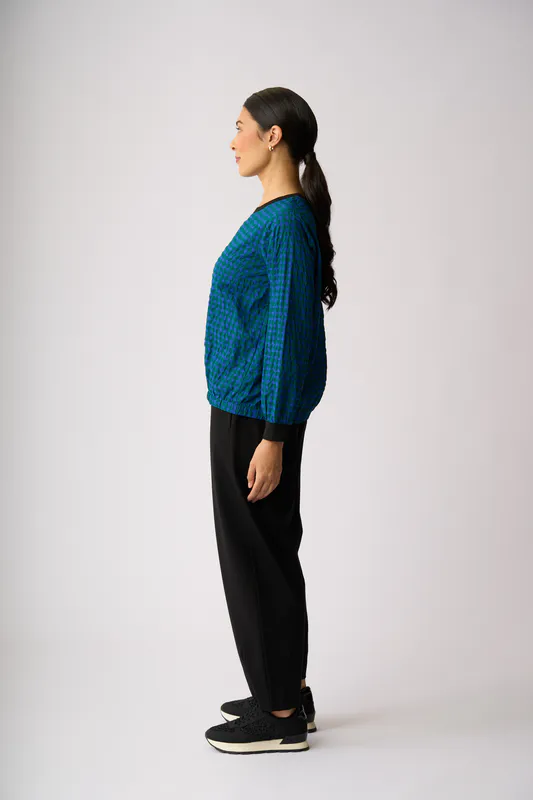 Model wearing Blue Spot Elastic Hem Detail Top By Memo Available at Beetees Nelson