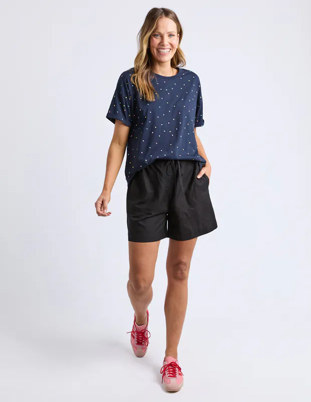 Model wearing Navy Festive Spot Tee By Elm Available at Beetees Nelson