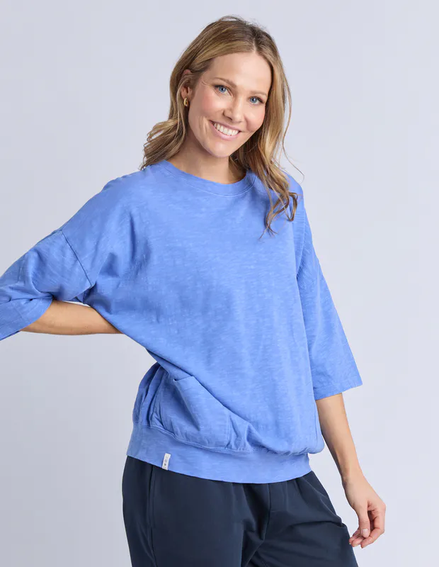 Model wearing Blue Maize Sweat By Elm Available at Beetees Nelson