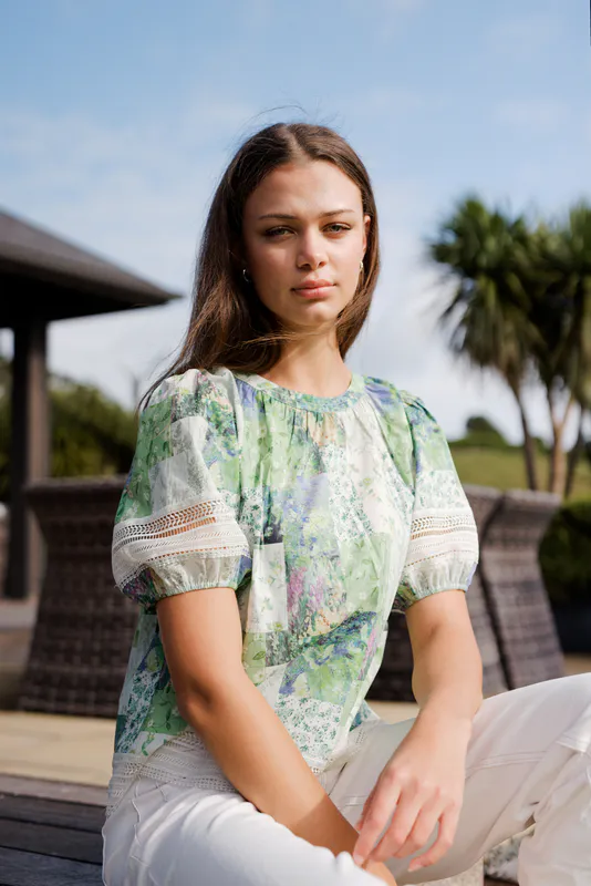 Model wearing Botanical Patch Paige Top By NMBR Rose Available at Beetees Nelson