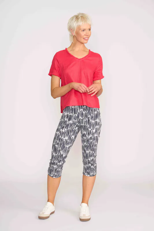 Model wearing Coral V Benefits Top By Foil Available at Beetees Nelson