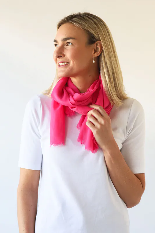Model wearing Bright Pink Vibrant Plain Scarf By Archer House Available at Beetees Nelson