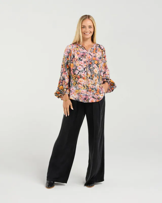 Model wearing Monet's Garden Phoebe Gathered Sleeve Top By Blackstone Available at Beetees Nelson