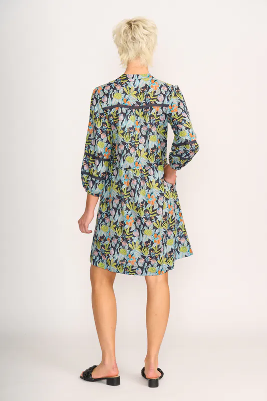 Model wearing Navy Floral Pintuck & Lace Dress By Foil Available at Beetees Nelson