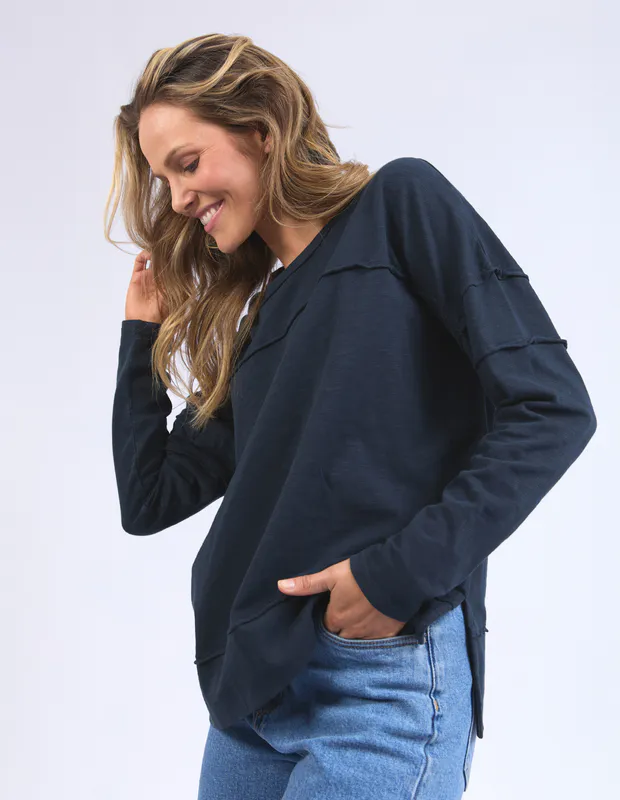Model wearing Navy Janye Throw On Top By Foxwood Available at Beetees Nelson