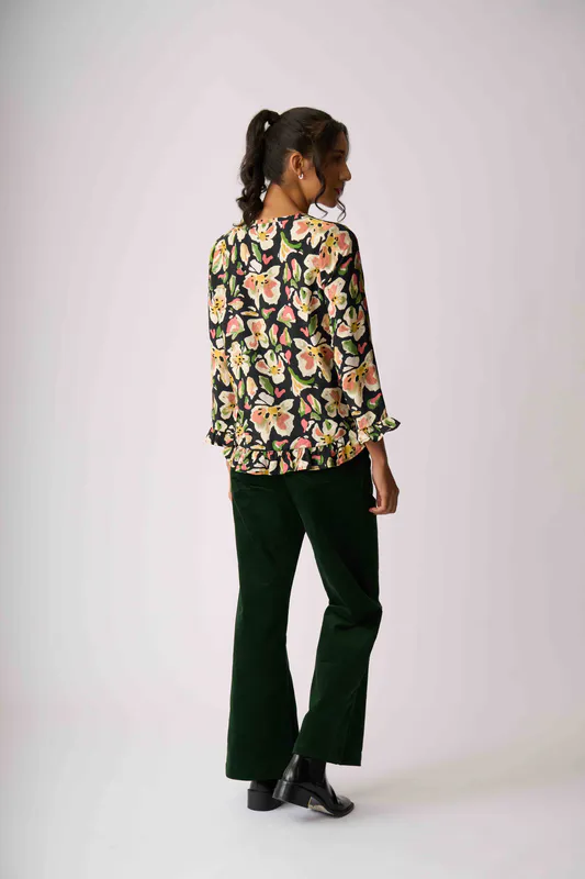Model wearing Forest Flora Gathered Scoop Hem Top By Preen Available at Beetees Nelson
