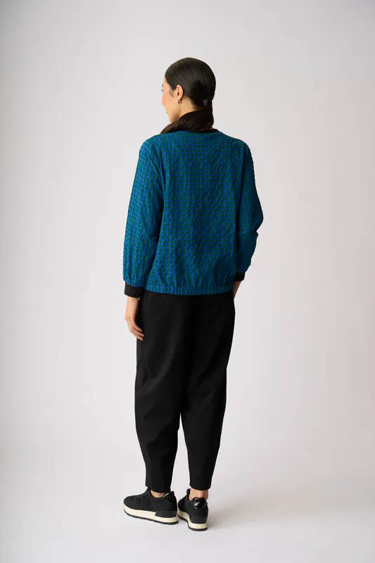 Model wearing Blue Spot Elastic Hem Detail Top By Memo Available at Beetees Nelson