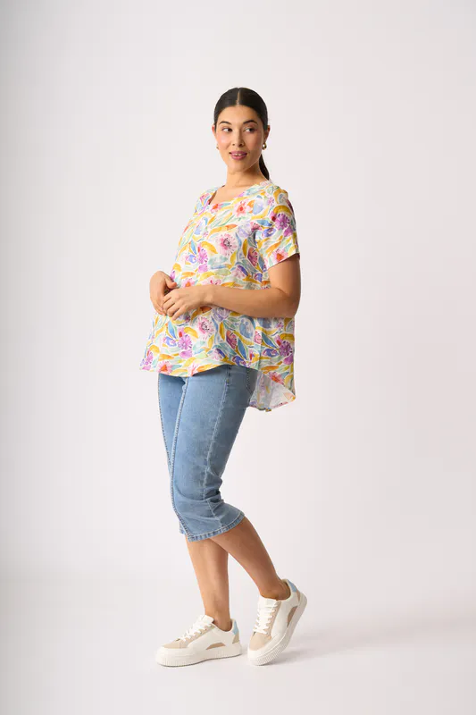 Model wearing Bright Blooms Top - Swing, Up Down Hem By Preen Available at Beetees Nelson