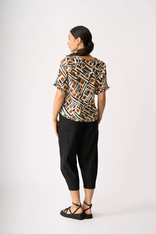 Model wearing Toffee Maze Ruffles & Scoop Hem Top By Foil Available at Beetees Nelson