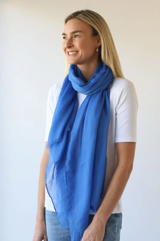 Model wearing Bright Blue Vibrant Plain Scarf By Archer House Available at Beetees Nelson