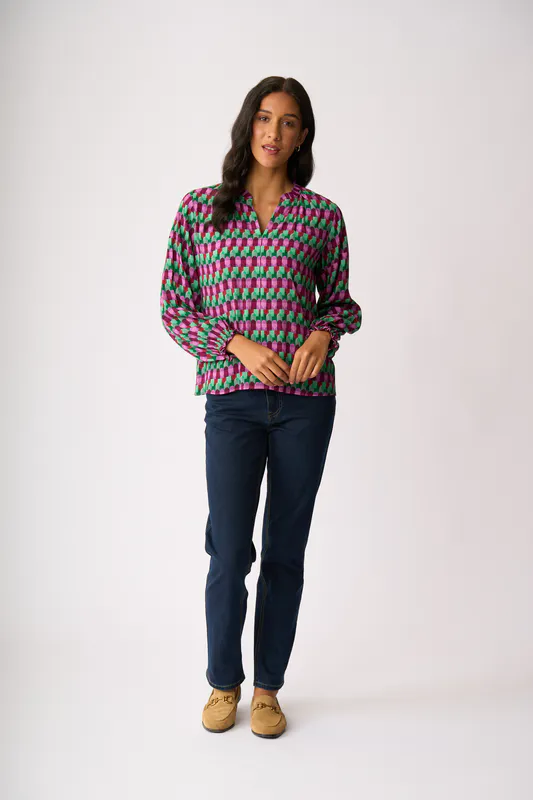 Model wearing Art Deco Elasticated Cuff Blouse By Foil Available at Beetees Nelson