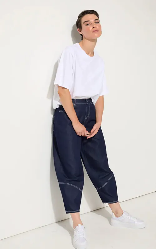 Model wearing Dark Denim Denim Barrel Leg Pant By Marco Polo Available at Beetees Nelson