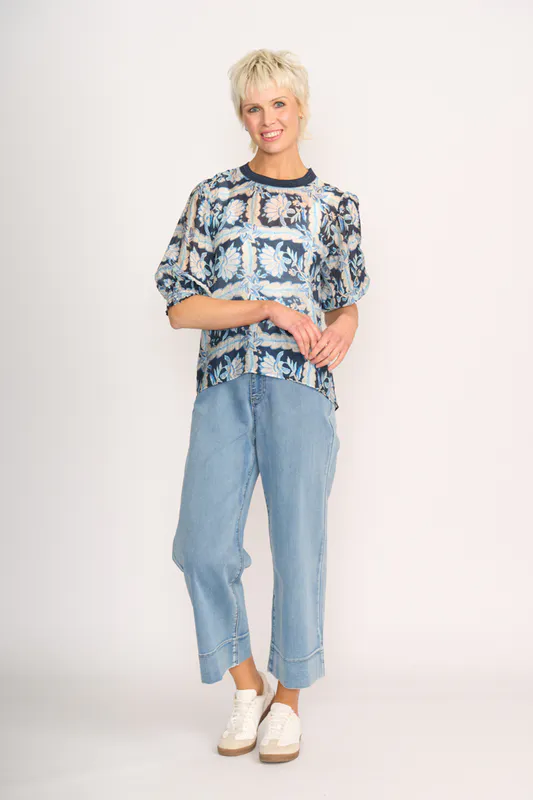 Model wearing Denim Floral Check Leopard Rib Trim Blouse By Memo Available at Beetees Nelson