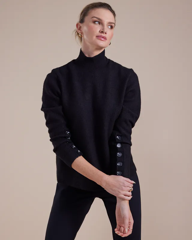 Model wearing Black Button Sleeve Boiled Wool Sweater By Marco Polo Available at Beetees Nelson