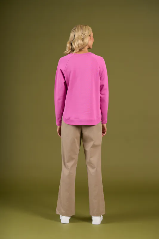 Model wearing Super Pink Brunswick Crew By Charlie Jane Available at Beetees Nelson