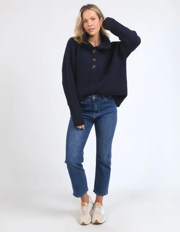 Model wearing Navy Bron Button Knit By Elm Available at Beetees Nelson