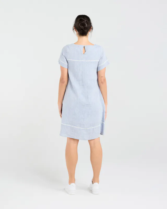 Model wearing Sky Blue CD Martine Ladder Trim Dress By Blackstone Available at Beetees Nelson