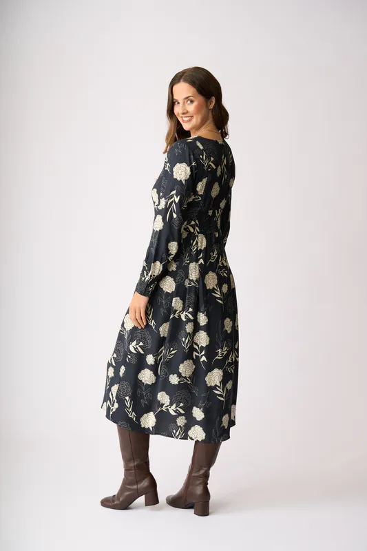 Model wearing Midnight Blooms Pleats Please Dress By Preen Available at Beetees Nelson