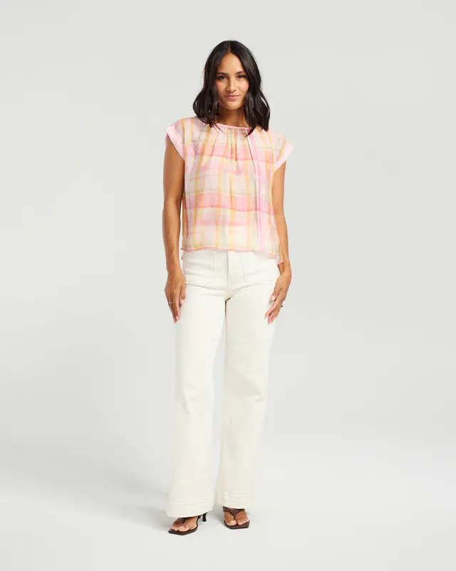 Model wearing Sunset Blush Sallie Top By NMBR Rose Available at Beetees Nelson