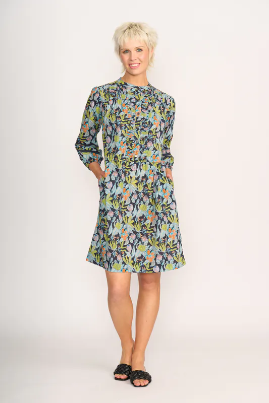 Model wearing Navy Floral Pintuck & Lace Dress By Foil Available at Beetees Nelson