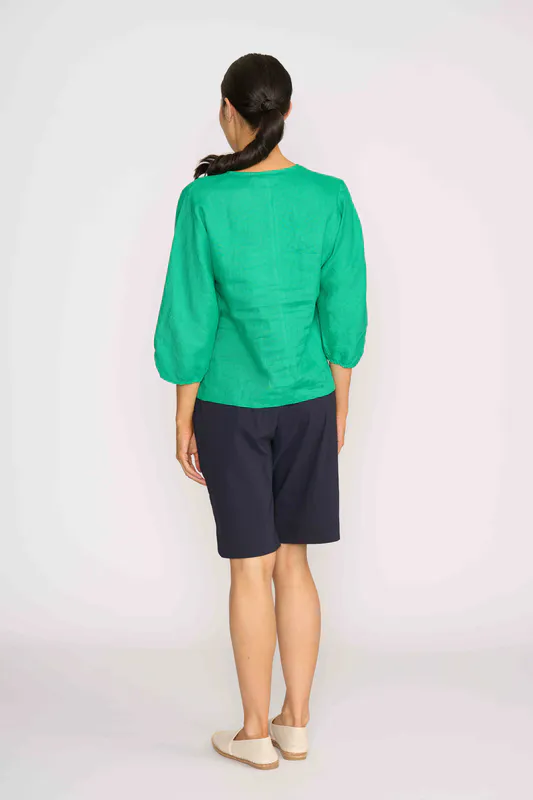 Model wearing Green Plot Twist Top By Foil Available at Beetees Nelson