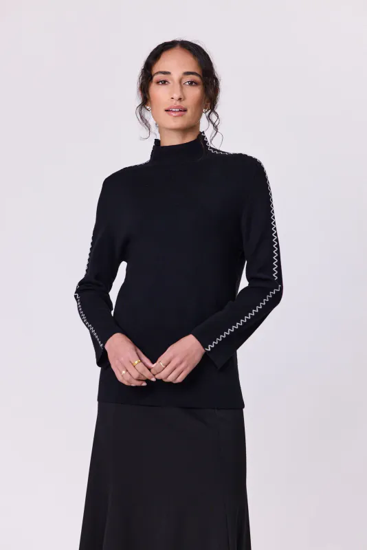 Model wearing Black Astral Turtle Knit By Navy & Co. Available at Beetees Nelson