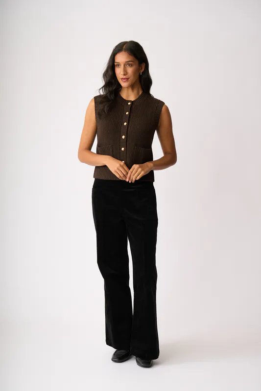 Model wearing Chocolate Cable Knit Detail Cardigan By Foil Available at Beetees Nelson