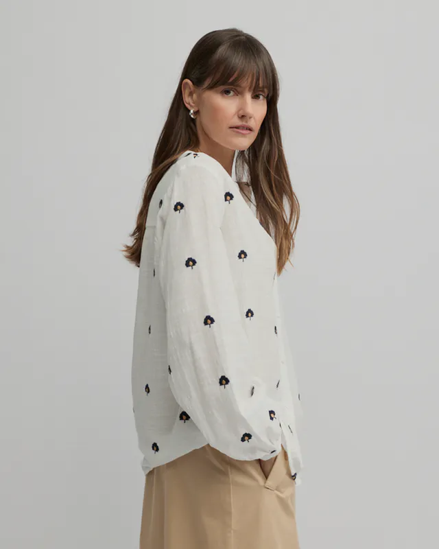 Model wearing Ecru Queens Shirt By Yarra Trail Available at Beetees Nelson