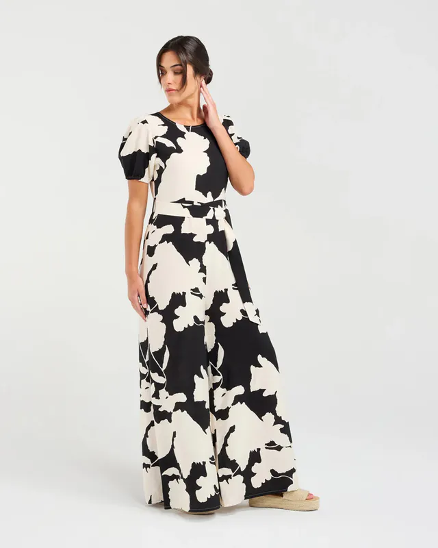 Model wearing Black Waterlily Juliana Tie Waist Jumpsuit By Blackstone Available at Beetees Nelson