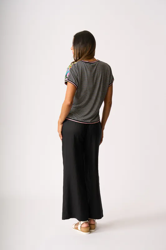 Model wearing Black Pull Together Pant By Foil Available at Beetees Nelson